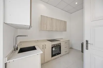 a white kitchen with a sink and a stove at Luxury Villa with Pool, Cinema & Spa - Jumeirah Golf in Dubai