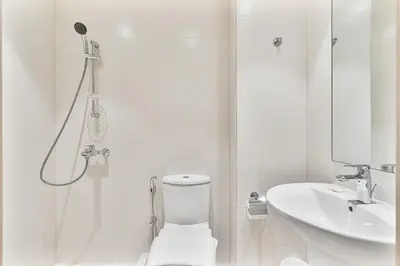 a bathroom with a shower and a toilet and a sink at Amazing 3BR APT Near Burj Khalifa and Dubai Mall in Dubai
