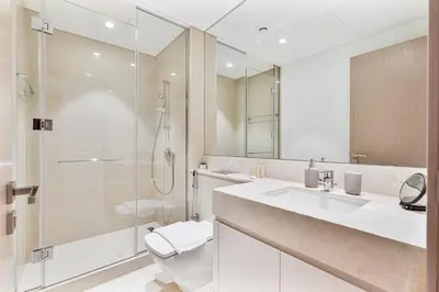 a bathroom with a shower and a sink and a toilet at Amazing 3BR APT Near Burj Khalifa and Dubai Mall in Dubai