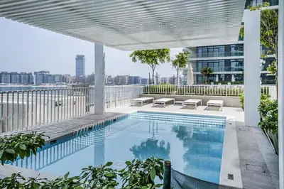 a swimming pool on the roof of a building at Sea View 2B Beachfront Luxury Emaar Beachfront in Dubai