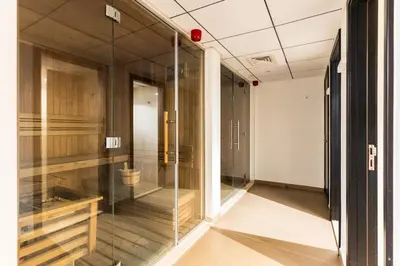 a glass corridor with a toilet in a room at DAYF-SKGMAR Upgraded Huge High-Floor Studio with Dubai Frame View in Dubai