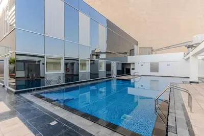 a swimming pool in the middle of a building at DAYF-SKGMAR Upgraded Huge High-Floor Studio with Dubai Frame View in Dubai