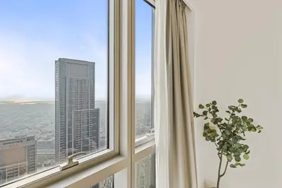 a window with a view of a city at Luxury 2BR at Signature Grande - Next to Dubai Mall & Burj Khalifa in Dubai