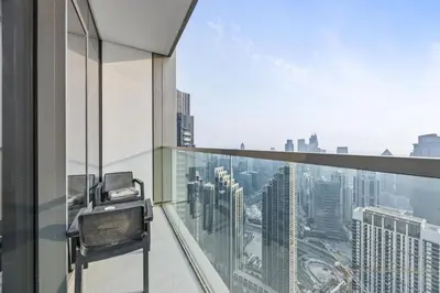 a balcony with a view of a city skyline at Luxury 2BR at Signature Grande - Next to Dubai Mall & Burj Khalifa in Dubai