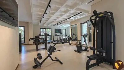 a gym with treadmills and cardio equipment in a room at Vogue Madinat Jumeirah Living Jadeel near Burj AlArab, Two-Bedroom Apartment with Large Balcony and Pool View, Access to All Amenities in Dubai