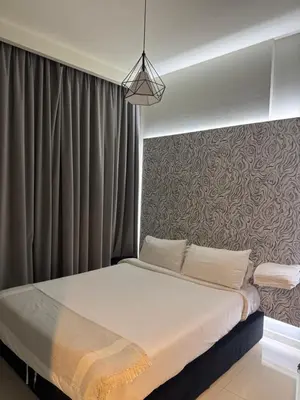 a bedroom with a large bed with a wall at Apartment Downtown Dubai in Dubai