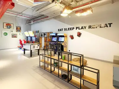 a room with several video games on display at FIRST CLASS 1BR Modern with Tranquil Touch in Dubai
