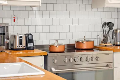 two pots sitting on top of a stove in a kitchen at FIRST CLASS 3BR Sea View Near JBR Beach in Dubai
