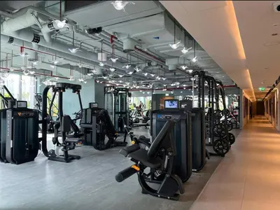 a gym with treadmills and exercise bikes in it at FIRST CLASS 2BR Pool View and near Dubai Mall in Dubai