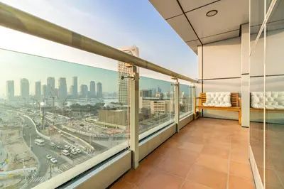 a balcony with a view of a city at Luxury 2BR in Dubai Marina Balcony, Views, Walk to Metro & Tram in Dubai