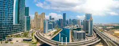 an aerial view of a city with a river and buildings at LUX 52 42 Deluxe Marina View Suite 3 in Dubai