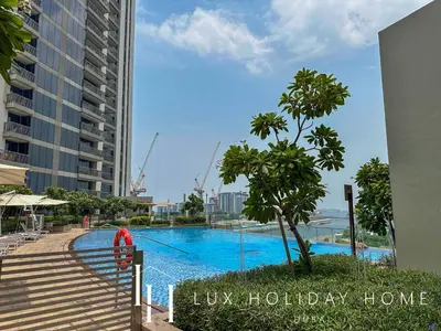a swimming pool in the middle of a building at LUX 52 42 Deluxe Marina View Suite 3 in Dubai