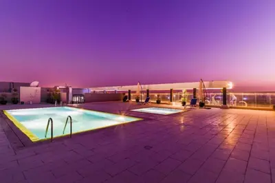 a swimming pool on the roof of a building at Southside Spacious & Sleek - 2BR in Dubai