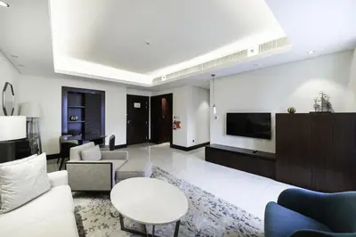a living room with a couch and a table at A&S Downtown Dubai in Dubai