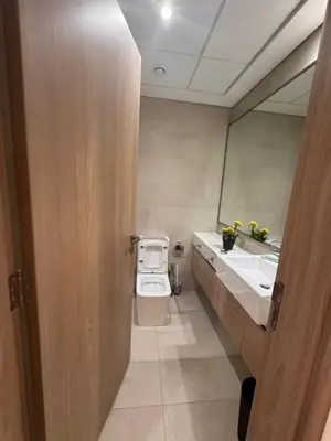 a bathroom with a toilet and a sink at Azizi Riviera Luxury Studio with Grand Balcony in Dubai