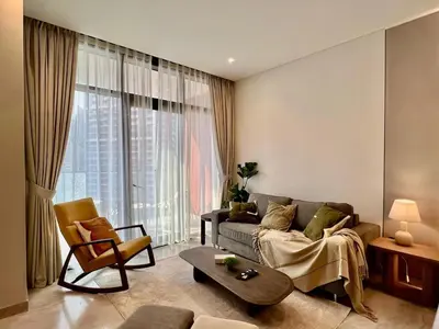 a living room with a couch and a chair at DAYF-PENZOR Upgraded Studio for 4 with Full Burj View in Dubai