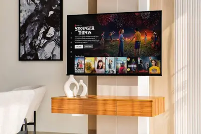 a flat screen tv hanging on a wall at SettlerHomes - Elite 2BR With Private Jacuzzi Oasis in Dubai