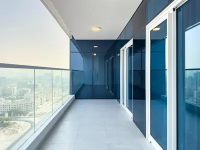 an empty corridor in an office building with glass windows at Superhost- 1BR Near Miracle Garden, Pool and Gym, Balcony Arjan in Dubai