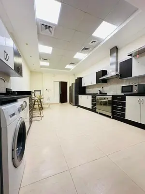 a large kitchen with a washing machine in it at Dubai Al Barsha Villa Fully Furnished Luxury Private Master Room Ensuite Huge Space Deluxe in Dubai
