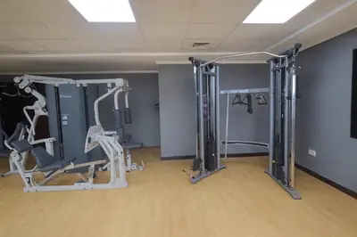 a gym with several tread machines in a room at Modern Studio with Marina Skyline view in JLT - Prime Location near Metro in Dubai