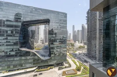 a view of a large glass building in a city at Vogue Business Bay Damac Cour Jardin close to Downtown, Burj Khalifa and Dubai Mall, Studio Apartment with City View, Access to all Amenities in Dubai