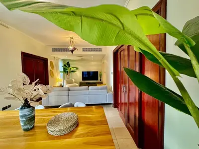 a living room with a table and a couch at Only family Walking distance to Dubai Mall in Dubai