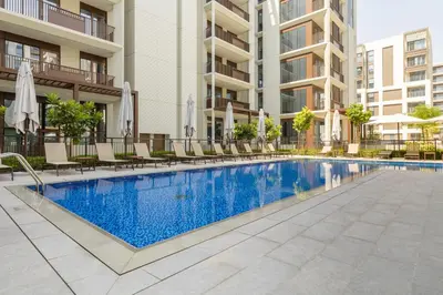 an image of a swimming pool in a building at Maison Privee - Charming Urban Escape with Resort-Style Facilities in Dubai