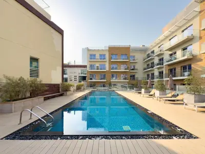an image of a swimming pool in a building at GuestReady – Relax Stay w Balcony & Pool View in Dubai