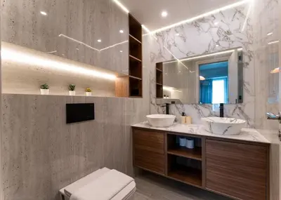 a bathroom with two sinks and a mirror at Modern 2-BR in 8-BLVD WALK Downtown Dubai in Dubai