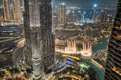 an aerial view of a city at night at FIRST CLASS 3BR Stunning Burj Khalifa View in Dubai