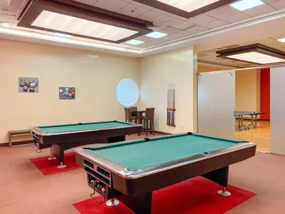 a billiard room with a pool table in it at FIRST CLASS1BR Sea View and Near Beach and Tram in Dubai