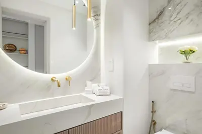 a bathroom with a sink and a mirror at FIRST CLASS1BR Sea View and Near Beach and Tram in Dubai
