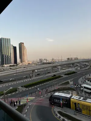 a highway with a train on it in a city at Al Zarooni building, Dubai marina in Dubai