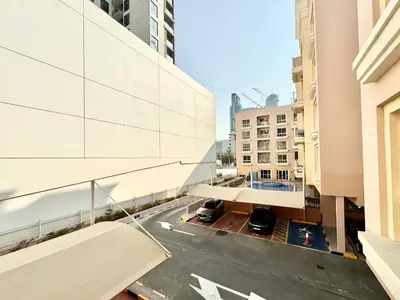 a view of a city street from a building at Homes2Retreat - JVC Charm - 1BR Apt with Private Balcony in Dubai
