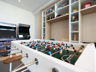 a room with a table with toy figures on it at Modern Neoclassical 1BR - Berkeley Place Dubai in Dubai