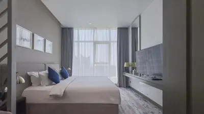 a hotel room with a bed and a television at Luxury Studio in Heart of Dubai in Dubai