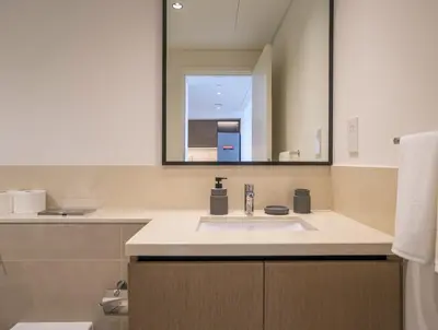 a bathroom with a sink and a mirror at A&S Properties Downtown Dubai in Dubai