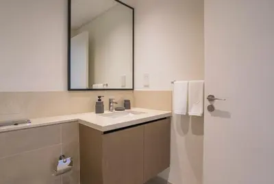 a bathroom with a sink and a mirror at A&S Properties Downtown Dubai in Dubai
