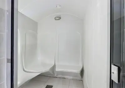 a shower in a bathroom with a glass door at Lux JVT Resort Pools Spa Gym Kids Play in Dubai