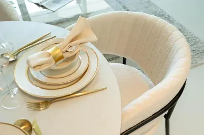 a table with a plate with a napkin on it at KeyRock - 1BR with Sea & Palm Jumeirah Views in Dubai