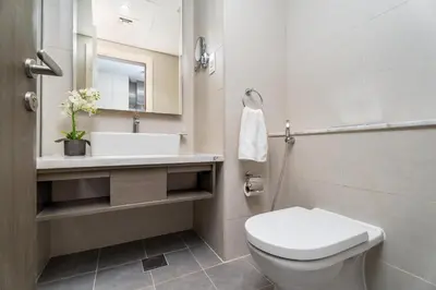 a bathroom with a toilet and a sink at GuestReady - Canal View | Studio + Sofa Bed in Dubai