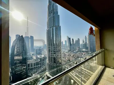 a view of a city from a window in a skyscraper at Kempinski Central Avenue Studio Burj view in Dubai