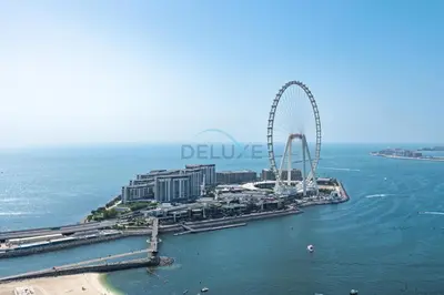 an aerial view of a city with a ferris wheel at Ain Dubai & Sea Views 2BR Unit Close to Beach, Shams 4, Jumeirah Beach Residence by Deluxe Holiday Homes in Dubai