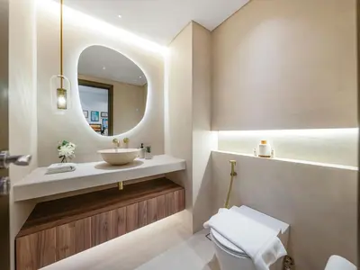 a bathroom with a sink and a mirror at Kensington Stylish 1BR at The Lofts East Downtown in Dubai