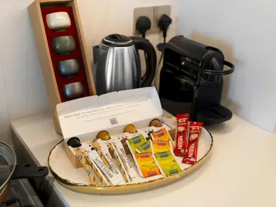 a tray with a box of food on a counter at Grande Signature Premium Stay in Dubai