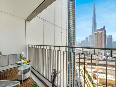 a balcony with a view of a city skyline at Stunning 2BR Dubai Mall Pool Gym Burj Khalifa in Dubai