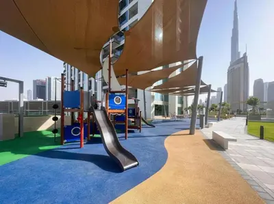 a playground in a building with a slide at Stunning 2BR Dubai Mall Pool Gym Burj Khalifa in Dubai