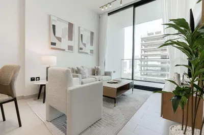 a living room with a couch and a table at TRPS - Binghatti Amber, JVC - Luxury 1BR Haven - Prime Location in Dubai