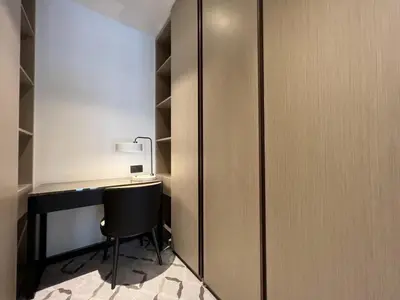 a closet with a desk and a chair in a room at Iconic 3BHK I Stunning Creek Views I Sleep up to 6 guests I High Floor I Pool I Free Parking I Pet Friendly I in Dubai