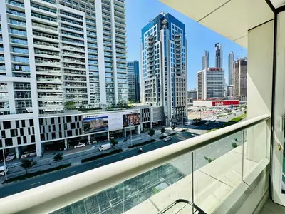 a balcony with a view of a city at Luxurious 1BR , Damac Maison Canal Views in Dubai